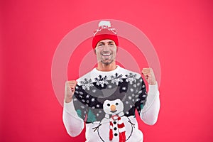 Happy 2020 year. Christmas concept. Guy in funny snowman sweater celebrate winter. Handsome man wear winter sweater