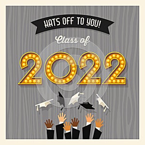 Happy 2022 graduation card design with vintage light bulb sign numbers and graduates throwing hats.