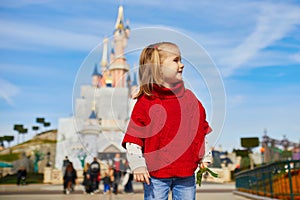 Happy 4 years old girl in Disneyland near Paris