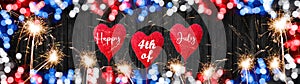Happy 4th of July background - Frame made of red blue white bokeh in the colors of the united states flag with hearts and firework