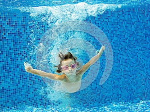 Happy active child jumps to swimming pool