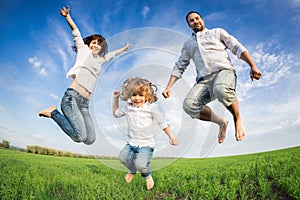 Happy active family jumping