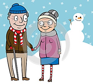 Happy active old couple on walk in winter