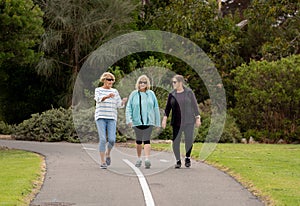 Happy active senior citizen women walking and training together in healthy retirement lifestyle