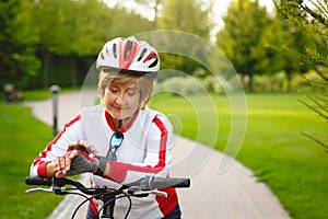 Happy active senior woman on bike