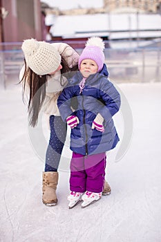 Happy adorable little girl and young mother