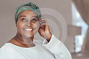 Happy adult African woman wearing on a stylish headscarf