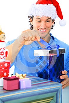 Happy Adult Caucasian Male Opening Gift