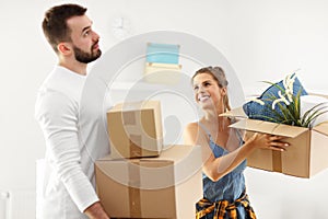 Happy adult couple moving out or in to new home