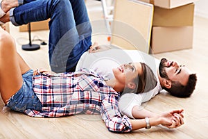 Happy adult couple moving out or in to new home