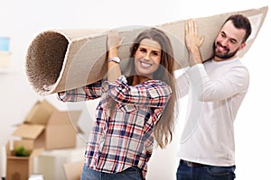 Happy adult couple moving out or in to new home