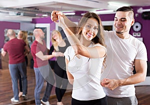 Happy adult couples enjoying of partner dance