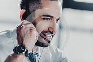 happy adult support hotline worker with microphone