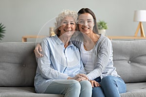 Happy affectionate two generation women grandmother and granddaughter portrait