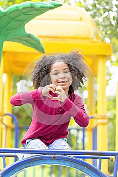 Happy African American Child playing in a park