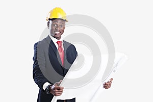 Happy african american construction worker holding blueprint