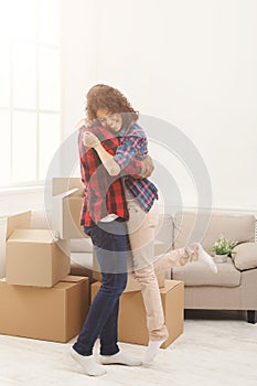 Happy african-american couple embracing at home