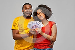 Happy african american couple with euro money