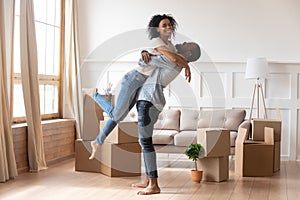 Happy african couple first time home buyers celebrate moving day photo