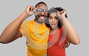 Happy african american couple in glasses hugging