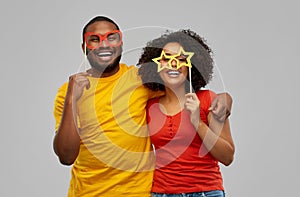 Happy african american couple with party props photo