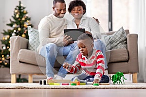 happy african american family on christmas at home