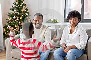 happy african american family on christmas at home