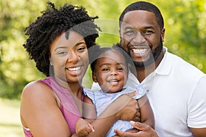 Happy African American family laughing and smiling.