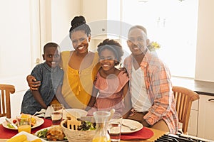 Happy African American family looking at camera