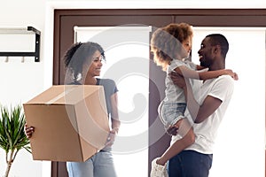 Happy African American family moving in new own house