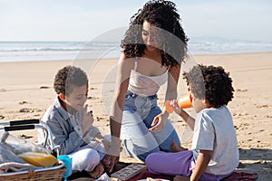 Happy African American family on picnic on beach