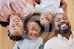 Happy african american family relaxing together and bonding at home. Little brother and sister spending time with their