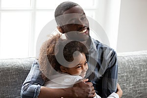 Happy African American family spending time together at home