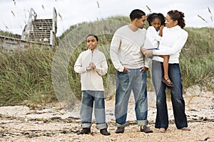 Happy African-American family standing together