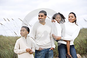 Happy African-American family standing together