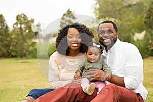 Happy African American family with their baby.