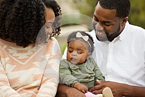 Happy African American family with their baby.