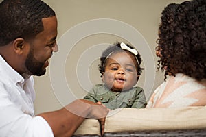 Happy African American family with their baby.