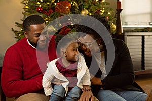 Happy African American family with their baby.