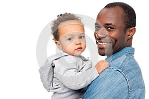 happy african american father and little son looking at camera