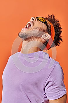 happy african american fella in eyeglasses photo