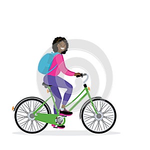 Happy african american female bicyclist with backpack