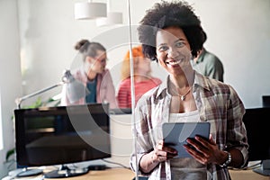 Happy african american female leader holding negotiations meeting with friendly diverse colleague