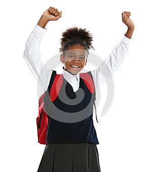 Happy African-American girl in school uniform on white