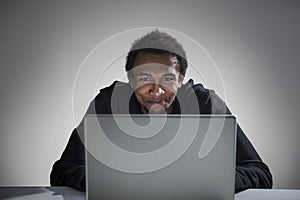 Happy African American hacker