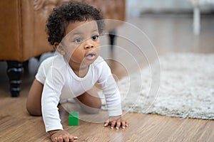 Happy African American Little baby boy crawling