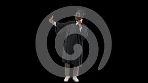 Happy african american male student in graduation robe taking phone selfies with his diploma, Alpha Channel