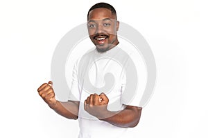 Happy African American man clenching fists