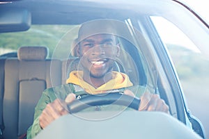 Happy african american man driving car