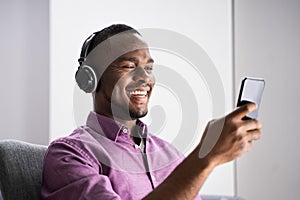 Happy African American Man Enjoying Music
